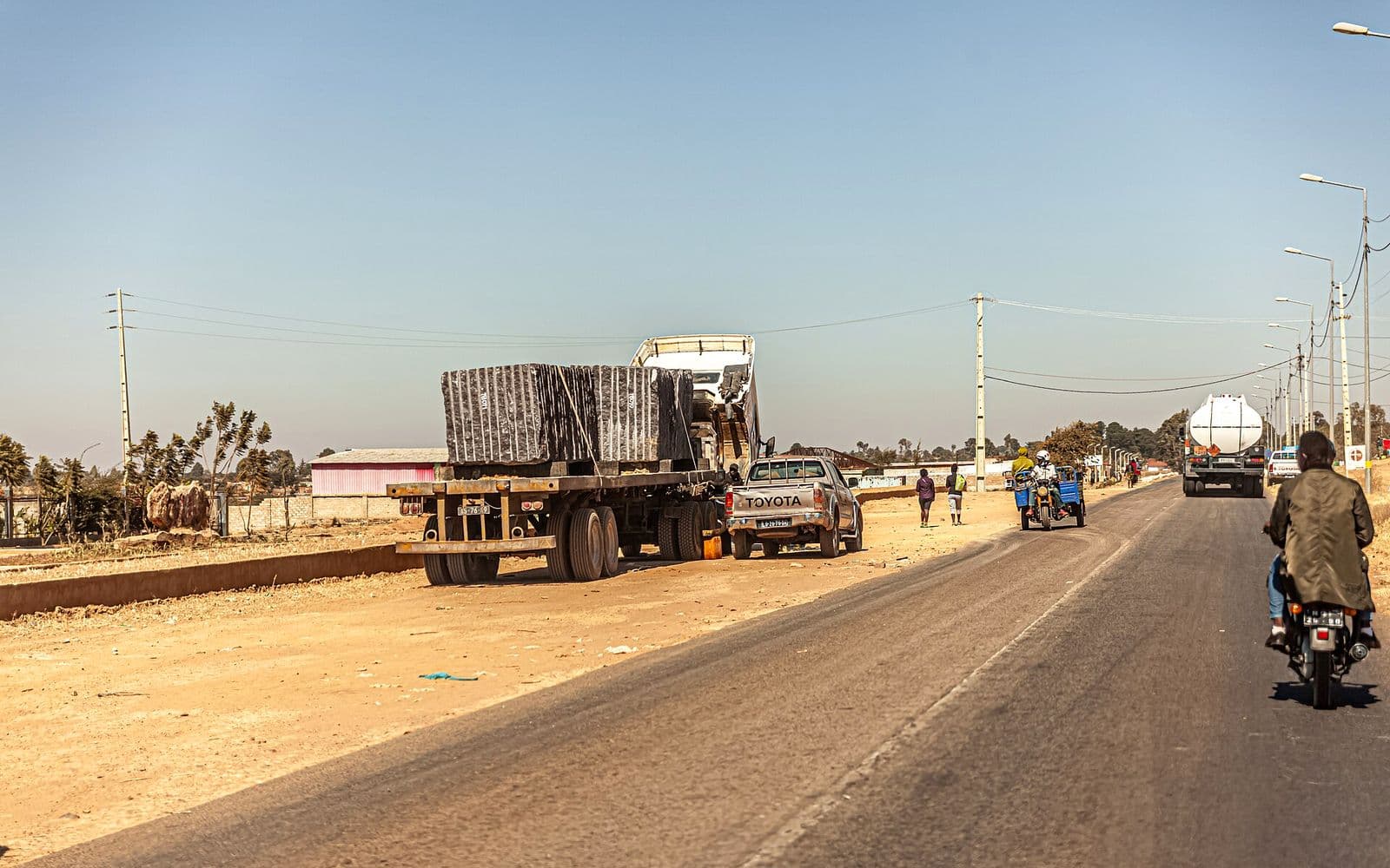 A loaded freight truck on a highway.